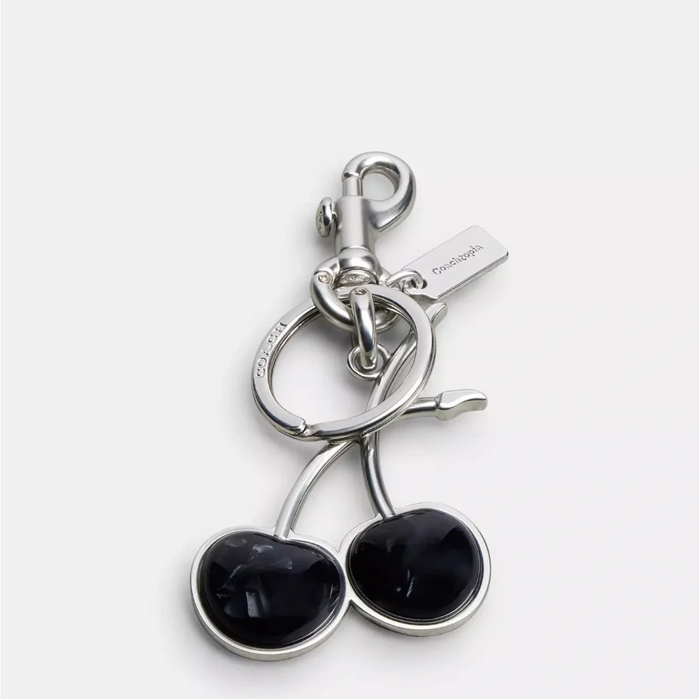 NWT Coachtopia Cherry Bag Charm keychain black silver with a dust bag CT392